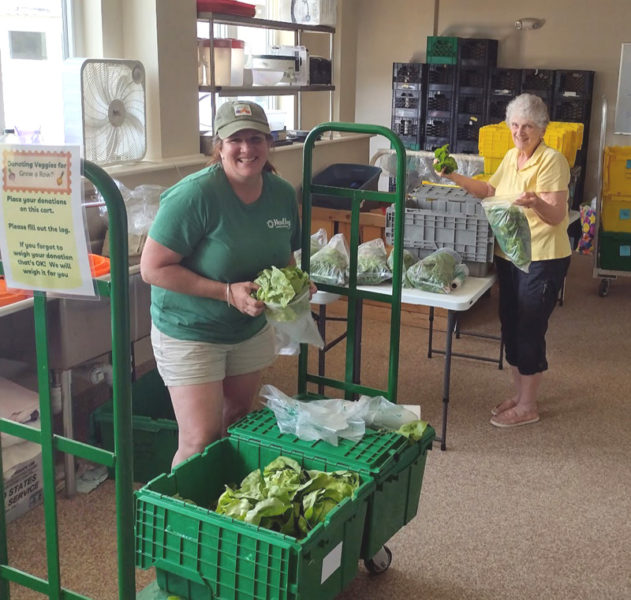 Healthy Lincoln County staff member Michaela Stone and volunteer Diane Newcomb process donated veggies for share tables. (Photo courtesy Leifa Gordon)