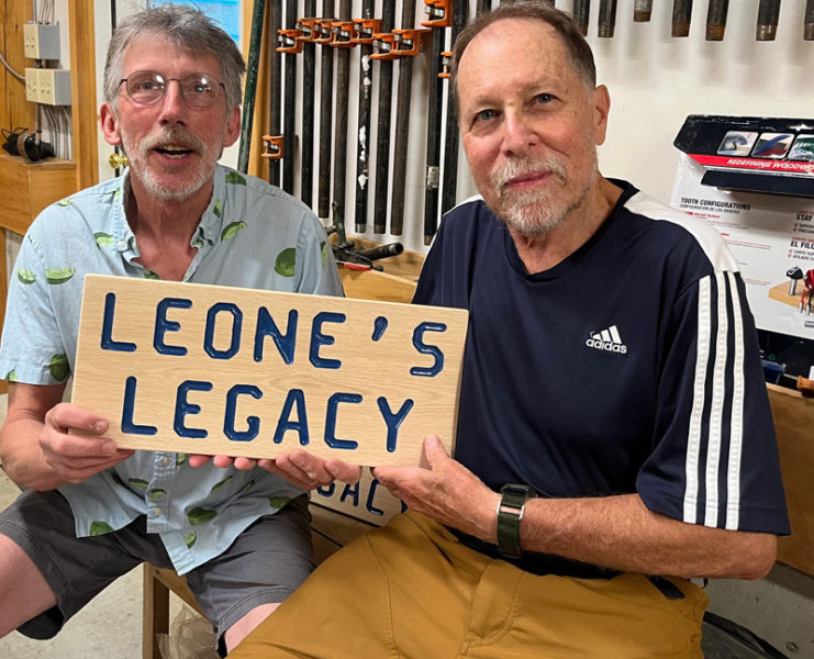 Mike Smith, former Edgecomb select board chair and past advisory board member, presented the trail sign to former advisory board chair Bob Leone at a pot luck cookout for the board. (Courtesy photo)