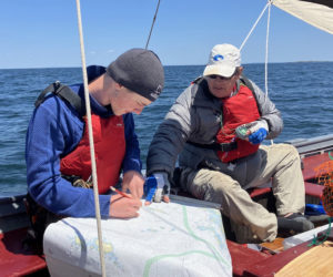 Carpenter's Boat Shop apprentices chart their 22-mile expedition to Matinicus Island. Expedition sailing is a new addition to the organizations nine-month apprenticeship program. (Photo courtesy Carpenter's Boat Shop)