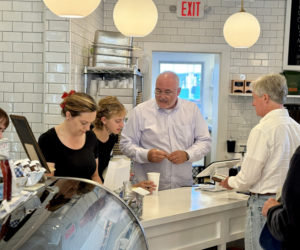 Prudence Kiessling (left), Alyssa Abbotoni, and Roger Kiessling run the counter at Rue 77 on Main Street in Damariscotta on Friday, June 28. In addition to a variety of espresso and coffee drinks, the cafe serves gelato from Gelato Fiasco in Brunswick, breakfast sandwiches utilizing local ingredients, and premade baguette sandwiches. (Johnathan Riley photo)
