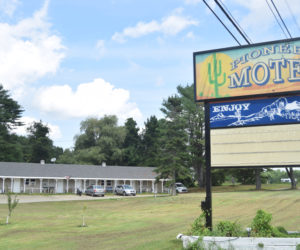 One of the Pioneer motel's buildings stands behind its sign on Tuesday, July 16. The motel is located on Route 1 in Edgecomb. (Nolan Wilkinson photo).