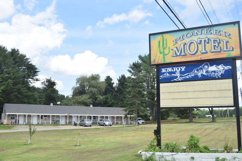 One of the Pioneer motel's buildings stands behind its sign on Tuesday, July 16. The motel is located on Route 1 in Edgecomb. (Nolan Wilkinson photo).