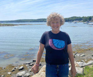 Kristie Houghton stands in front of the Damariscotta River. The Newcastle resident has made her mark on the community as a preschool teacher at Fiddlehead, a kindergarten, second, and third grade teacher at GSB, and will now move onto Lincoln Academy as a college and career counselor. (Frida Hennig photo)