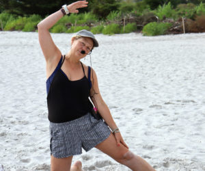 Damariscotta resident Sarah Plummer leads a yoga class on the beach at Pemaquid Beach Park in Bristol the evening of Tuesday, July 23. A music teacher, yoga instructor, and all-around active member of the community, Plummer said she strives to inspire every person she meets to connect with nature and reach their potential in mind, body, and spirit. (Piper Pavelich photo)