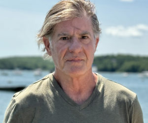 Award-winning journalist Robert Conlin stands in front of the Damariscotta River at the town landing on Friday, July 26. The Wiscasset-based author released his latest book The Lewiston Shooting: an all-American tragedy with Wild Blue Press on Tuesday, July 30. (Johnathan Riley photo)