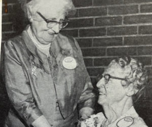 A photo of Adelaide Butnam pinning a corsage on a fellow alumna at a Westbrook reunion in 1969. Butnam was in her early 80s at the time the photo was taken. (Photo courtesy Michael Uhl)