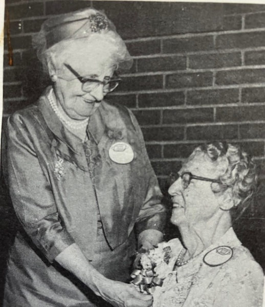 A photo of Adelaide Butnam pinning a corsage on a fellow alumna at a Westbrook reunion in 1969. Butnam was in her early 80s at the time the photo was taken. (Photo courtesy Michael Uhl)