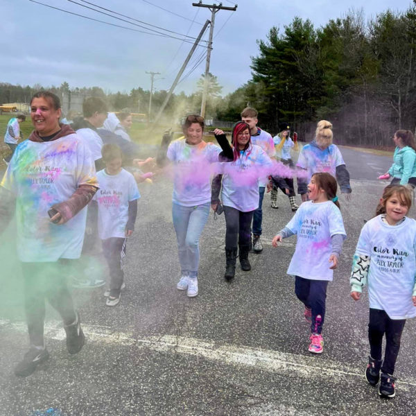 Participants walk through clouds of color during the You Are Deeply Loved Color Run. (Courtesy photo)