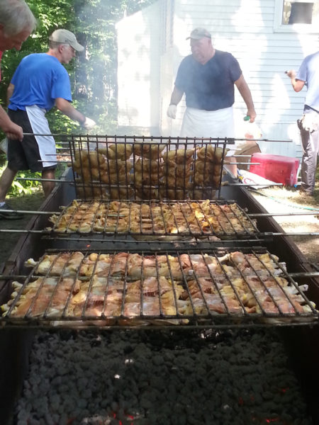 North Nobleboro Day's chicken pit crew hard at work. (Courtesy photo)