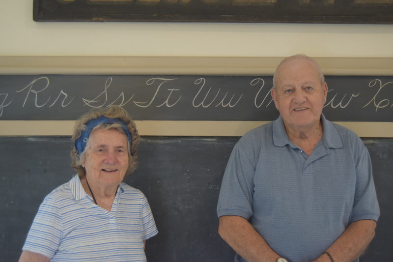 Joan Gregoire and Joseph Seigars stand in their former school Tuesday, July 30. Both were students at the Village School over 80 years ago. (Nolan Wilkinson photo)