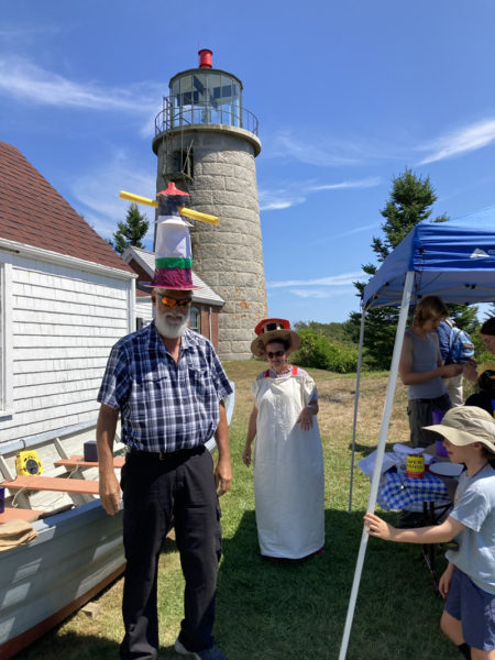 A group makes lighthouse hats during a celebration of the Monhegan light stations 200th anniversary on Thursday, Aug. 8. The celebration was put together by the Monhegan Museum, whom oversees the property the lighthouse is on. (Courtesy photo)