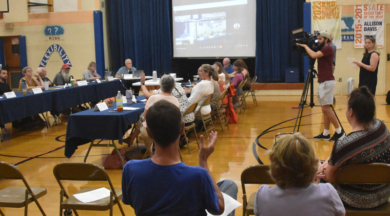 The RSU 40 Board of Directors conducts a roll-call vote on whether to reinstate a previously deleted policy regarding transgender and gender expansive students on Thursday, Aug. 1. The board ultimately voted 568-390 to reinstate the policy. (Molly Rains photo)