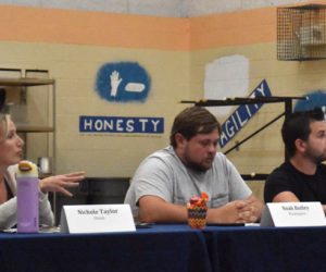 RSU 40 Board of Directors members Nichole Taylor, of Union; Noah Botley, of Washington; and Joshua Blackman, of Warren, discuss reinstating the district's transgender and gender expansive student policy on the evening of Thursday, Aug. 1. Taylor, Botley, and Blackman all voted against reinstating the policy. Taylor said that the board could not reneg on a previous decision, while Blackman said the discussion represented a larger conspiracy and called gender theory "fake." (Molly Rains photo)