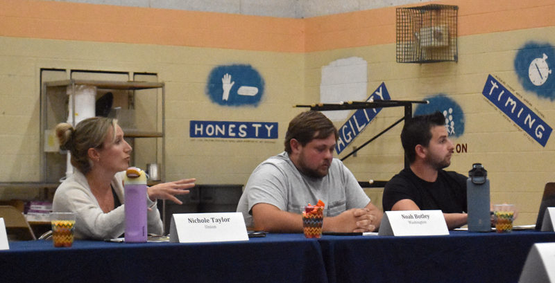 RSU 40 Board of Directors members Nichole Taylor, of Union; Noah Botley, of Washington; and Joshua Blackman, of Warren, discuss reinstating the district's transgender and gender expansive student policy on the evening of Thursday, Aug. 1. Taylor, Botley, and Blackman all voted against reinstating the policy. Taylor said that the board could not reneg on a previous decision, while Blackman said the discussion represented a larger conspiracy and called gender theory "fake." (Molly Rains photo)