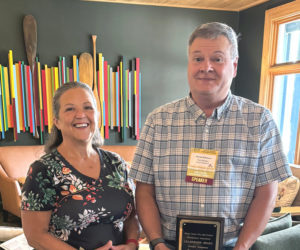 Wiscasset Town Manager Dennis Simmons (right) poses for a photo with Wiscasset Select Board member Pamela Dunning after being awarded the Maine Town, City, and County Management Association Leadership Award on Wednesday, Aug. 14. (Photo courtesy Aaron Chrostowsky)