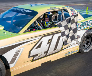 Dan McKeage, Jr. collects the checkered following his Strictly Street win at Wiscasset Speedway Saturday, Aug. 3. (Photo courtesy David Montgomery of Mainemmonty Media)