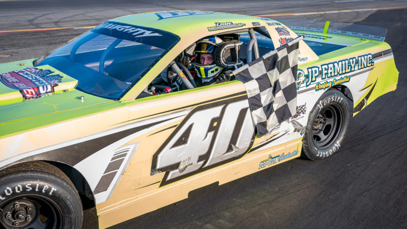 Dan McKeage, Jr. collects the checkered following his Strictly Street win at Wiscasset Speedway Saturday, Aug. 3. (Photo courtesy David Montgomery of Mainemmonty Media)