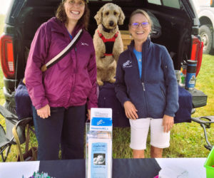 Leifa Gordon, Healthy Lincoln County staff member, Ginger Roberts-Scott, director of the Maine WIC Nutrition Program, and Gingers dog visit the Rockland Farmers Market. (Photo courtesy Healthy Lincoln County)