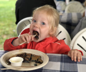 Eleanor Gerdts, of Texas, enjoys a bite of blueberry pancake at Fields Fields Blueberries during Wild Blueberry weekend, in Dresden Sunday, Aug. 4. The delicious sweet treats were a highlight of an event attended by hundreds of locals and visitors. (Sarah Masters photo)