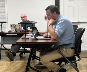 Newcastle Planning Board Chair Ben Frey (left) looks to Newcastle Town Planner Michael Martone to explain the proposed amendments to the town's core zoning code ordinance, which define and regulate the retail sales of firearms in the vicinity of schools, during a public hearing the evening of Thursday, Sept. 19. (Piper Pavelich photo)