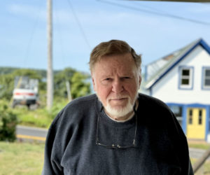 Larry Kelsey, of South Bristol, stands on the porch of the South Bristol Historical Society on Thursday, Sept. 12. Kelsey, who has served on the towns select board, planning board, and school committee, is the president of the historical society. (Johnathan Riley photo)