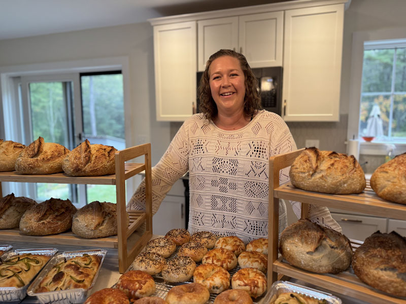 Ari Barter, owner of Walpole Wildflours, stands behind her cooling baked goods in her home kitchen in Walpole on Friday, Sept. 20. Barter learned how to bake when one of her children developed a food sensitivity. (Johnathan Riley photo)