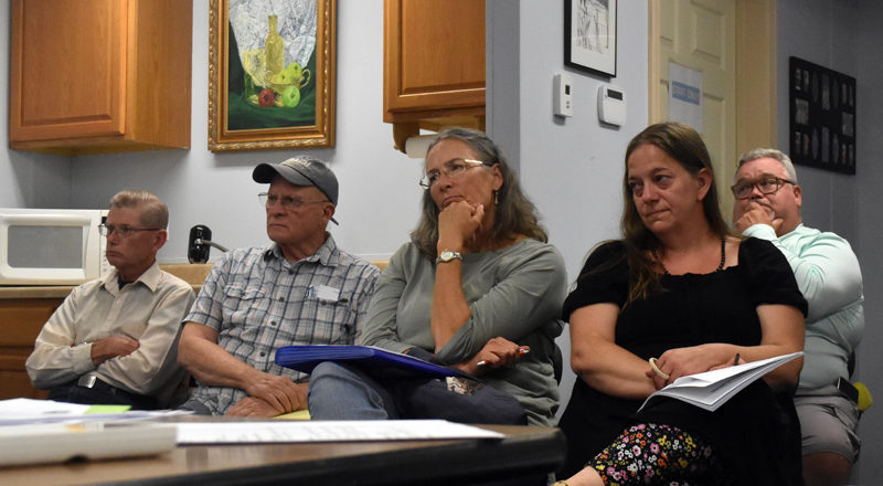 Somerville residents listen to the select board announce multiple resignations of town officials the evening of Wednesday, Sept. 18. Some blamed disrespectful behavior from community members for the departure of town office staff. "There must be a standard established for decorum, because what they've had to endure is just ridiculous," said Kelly Grenier (center), a resident and former town employee. (Molly Rains photo)