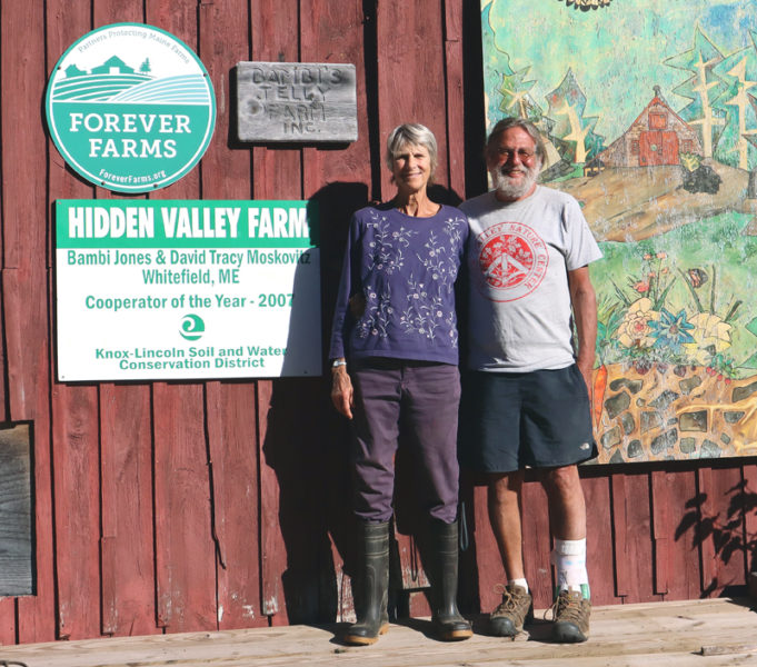 Bambi Jones (left) and David "Tracy" Moskovitz stand in front of a barn at Hidden Valley Farm in Whitefield the afternoon of Monday, Sept. 9. Hidden Valley Farm is one of four finalists for the 2024 New England Leopold Conservation Award, which celebrates achievement in conservation by agricultural landowners. (Piper Pavelich photo)