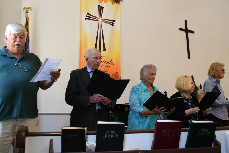 From left: John Boak, John Tutton, Ava Keene, Louise Nicolosi, and Donna Finneran sing Albert Brumley's "I'll Fly Away" as part of the Bremen Union Church choir on Sunday, Sept. 29. (Nolan Wilkinson photo)