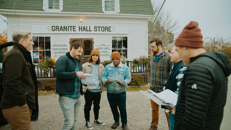 Cast and crew of "McCurdy Point" discuss a scene in front of Granite Hall Store in Round Pond. Filming took place in 2022. (Courtesy photo)