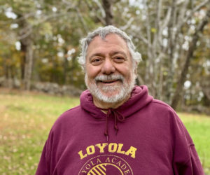 Nick Azzaretti stands in the yard of his Newcastle home on Thursday, Oct. 10. Azzaretti is a poet, teacher, and was the director of information technology at Lincoln Academy in Newcastle from 1993 until 2019. (Johnathan Riley photo)