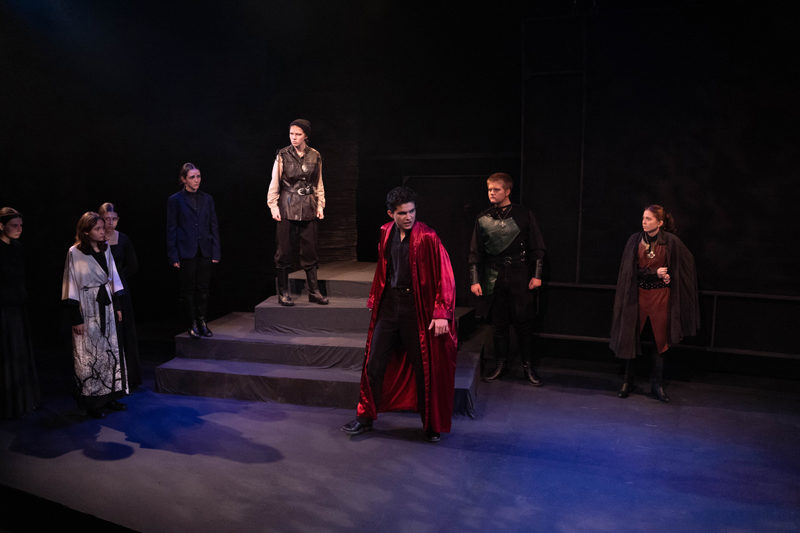 Macbeth (center), woken from a post-party stupor, swears to catch the killer of the king, an act he himself committed. The students of Lincoln Academy tackle Shakespeares tragedy at the Parker B. Poe Theater in final performances this weekend. (Photo courtesy Jenny Mayher)