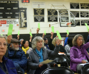 Newcastle residents vote to approve amendments to the core zoning code regarding retail firearm sales at the Lincoln Academy gymnasium in Newcastle on Tuesday, Oct. 15. The amendments were approved with a vote of 43-5. (Nolan Wilkinson photo)