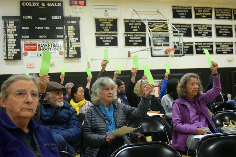 Newcastle residents vote to approve amendments to the core zoning code regarding retail firearm sales at the Lincoln Academy gymnasium in Newcastle on Tuesday, Oct. 15. The amendments were approved with a vote of 43-5. (Nolan Wilkinson photo)