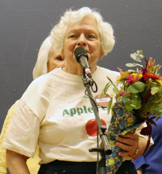 Mary Sheldon, president of the Nobleboro Historical Society, addresses the crowd at Nobleboro's 19th annual AppleFest the afternoon of Saturday, Oct. 5. Volunteers and historical society members recognized Sheldon for nearly two decades of service to the community. (Piper Pavelich photo)