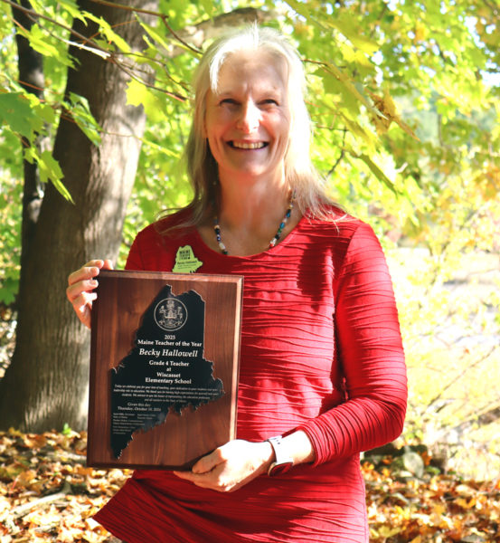 Wiscasset Elementary School teacher Becky Hallowell holds her 2025 Maine Teacher of the Year award in an outdoor classroom at the school the morning of Thursday, Oct. 10. (Piper Pavelich photo)