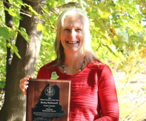 Wiscasset Elementary School teacher Becky Hallowell holds her 2025 Maine Teacher of the Year award in an outdoor classroom at the school the morning of Thursday, Oct. 10. (Piper Pavelich photo)