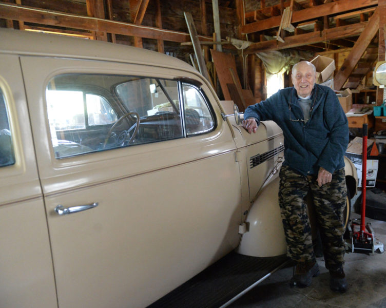 Errol T. Clark, 95, of South Jefferson, stand with the 1939 Chevy hot rod he purchased at the age of 23. (Paula Roberts photo)