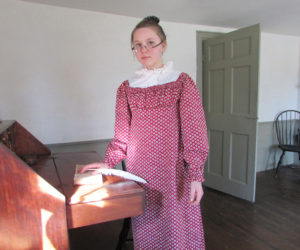 Reading in the parlor of the Chapman-Hall House in Damariscotta. The house will be open for tours during a coopersmith demonstration over Pumpkinfest weekend. (Photo courtesy Lincoln County Historical Association)