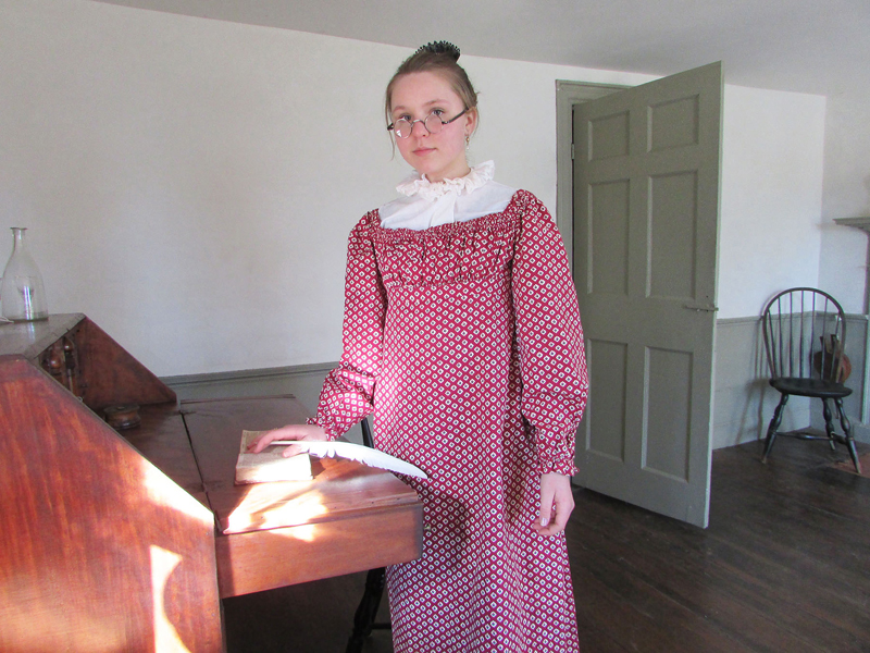 Reading in the parlor of the Chapman-Hall House in Damariscotta. The house will be open for tours during a coopersmith demonstration over Pumpkinfest weekend. (Photo courtesy Lincoln County Historical Association)