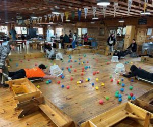 Scout Chris Clark (left) pushes Scout Ian Michaud in a game of Hungry Hungry Hippos at the "Got Games" event. (Photo courtesy Ian Michaud)