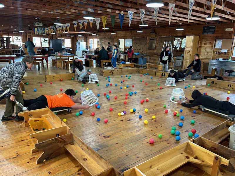 Scout Chris Clark (left) pushes Scout Ian Michaud in a game of Hungry Hungry Hippos at the "Got Games" event. (Photo courtesy Ian Michaud)