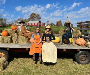 Visitors dress in farmer costumes in Pumpkin Vine's famous "Farmer FotoBooth" during the 2022 harvest festival. (Photo courtesy Kelly Payson-Roopchand)