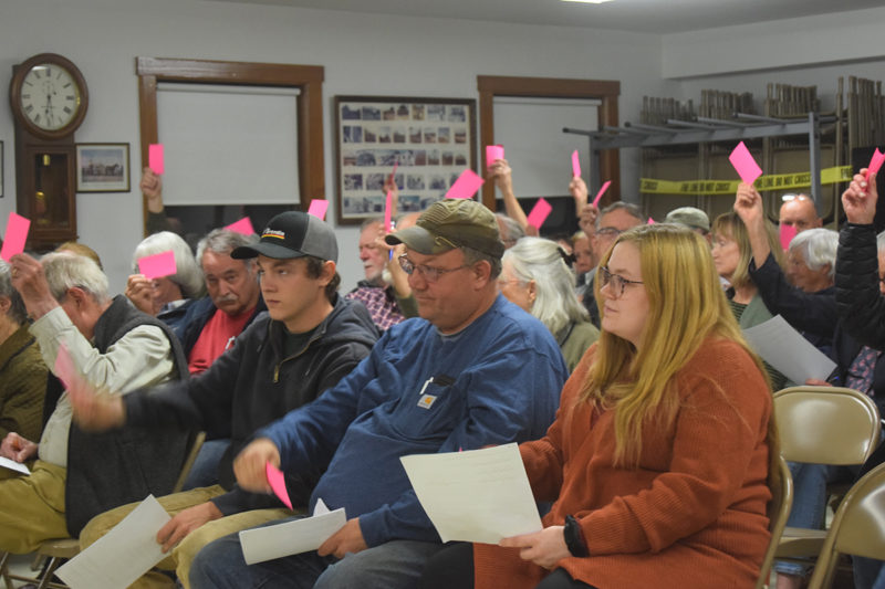 Alna residents vote to approve article six of their special town meeting warrant at the Alna fire station meeting room on Friday,  Nov. 1. Article six, the most contentious item on the warrant, allows the town to spend up to $167,000 on matching an around $835,000 grant from the Maine Department of Transportation for the replacement of the Ben Brook culvert on Egypt Road. (Nolan Wilkinson photo)