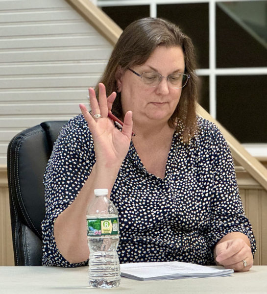 Bristol Select Board member Kristine Poland votes to approve a motion at the Wednesday, Nov. 6 meeting. Bristol Select Board members set Wednesday, Dec. 4 as the date of a special town meeting at which voters will decide whether to declare a structure in New Harbor as dangerous and to pay for its removal. (Johnathan Riley photo)