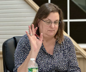 Bristol Select Board member Kristine Poland votes to approve a motion at the Wednesday, Nov. 6 meeting. Bristol Select Board members set Wednesday, Dec. 4 as the date of a special town meeting at which voters will decide whether to declare a structure in New Harbor as dangerous and to pay for its removal. (Johnathan Riley photo)