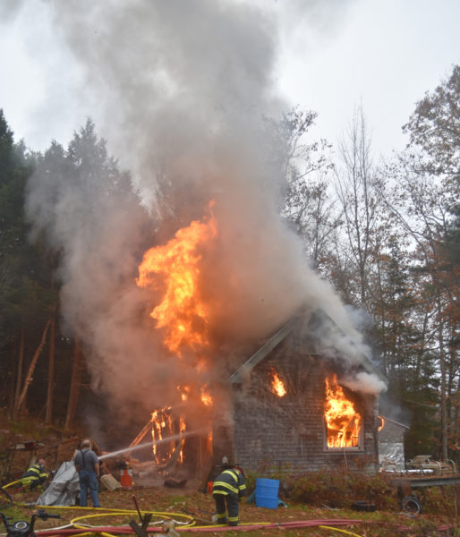 Firefighters battle a barn fire in Jefferson on the afternoon of Wednesday, Oct. 30. (Molly Rains photo)