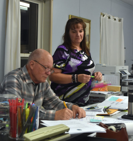 New Somerville Town Clerk Russell Gates makes notes during a select board meeting on Wednesday, Nov. 20 while Treasurer and interim Registrar and Tax Collector Sandra Devaney looks on. Gates' first day as clerk was Nov. 20, bringing Somerville's months-long period of having only one town office staffer to a close. (Molly Rains photo)