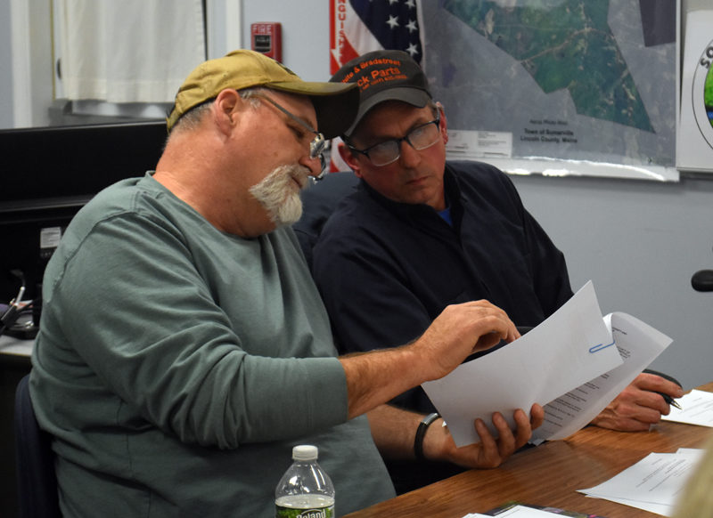 Newly elected Somerville Select Board Chair Willard Pierpont (left) looks through correspondence with fellow select board member Don Chase. Pierpont was elected by a 2-0 vote Wednesday, Nov. 20. He and Chase will remain the only members of the board until townspeople elect a third select board member in a special election set for Tuesday, Jan. 7. (Molly Rains photo)