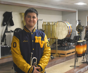 Luis Cordero, a senior at Medomak Valley High School, stands with his trumpet in the school's band room on Thursday, Nov. 21. In January, Cordero will be the first Medomak Valley High School student to participate in the Maine Jazz All-State ensemble. "I really connect to jazz," Cordero said. (Molly Rains photo)